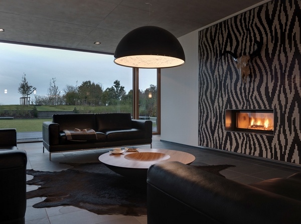 modern-living-room-black-furniture-black-area-rug-decorative-wall-fireplace