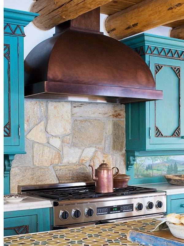 natural stone rustic copper hood blue cabinets