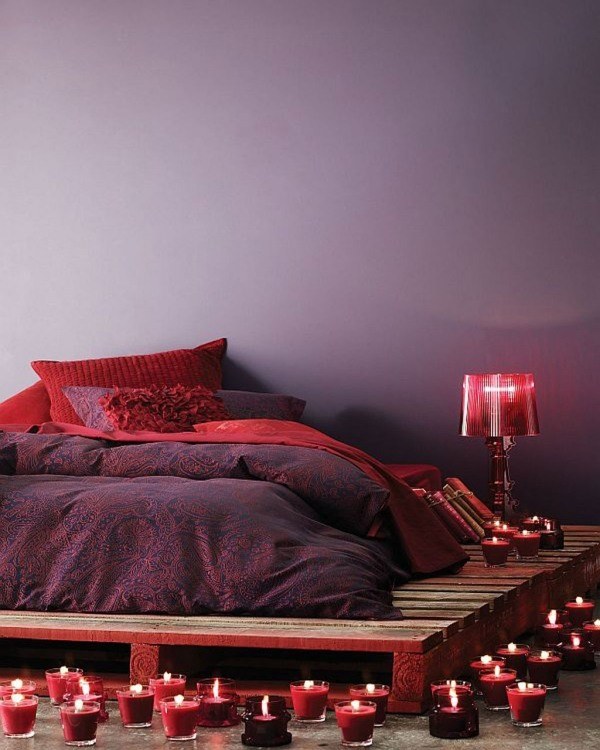 platform bed purple red bedding romantic atmosphere candles
