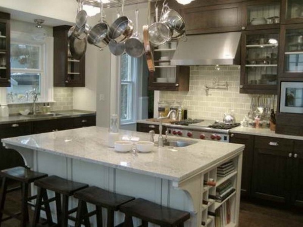 white kitchen island bianco romano granite countertop dark wood kitchen cabinets