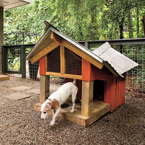 wooden dog home with deck sloping roof