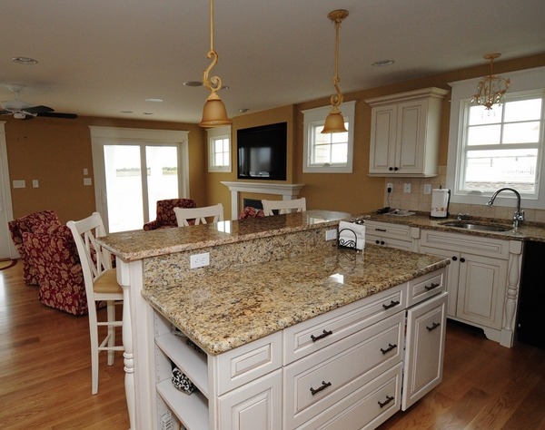 Santa Cecilia granite countertops white cabinets hardwood floor