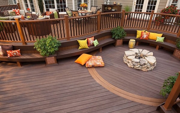 contemporary decking ideas round deck curved railing firepit bench decorative pillows