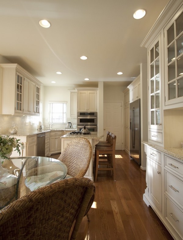 giallo-ornamental-granite-countertops-kitchen-ideas-white-cabinets-glass-doors