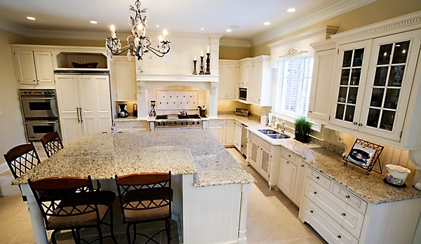 golden-giallo-ornamental-granite-countertops-white-kitchens
