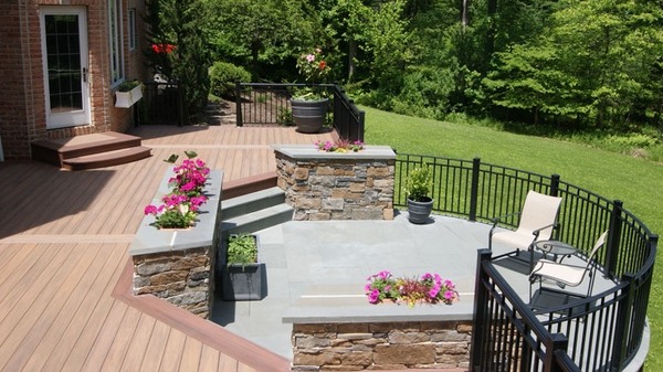 modern PVC decking custom railings stone walls contemporary patio design