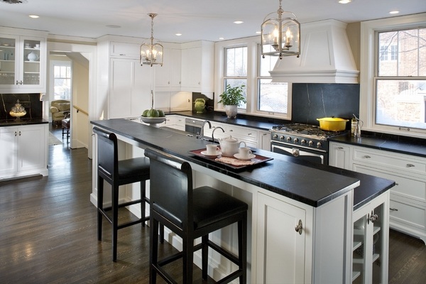 modern-kitchen-design-white-cabinets-soapstone-countertops-black-bar-stools