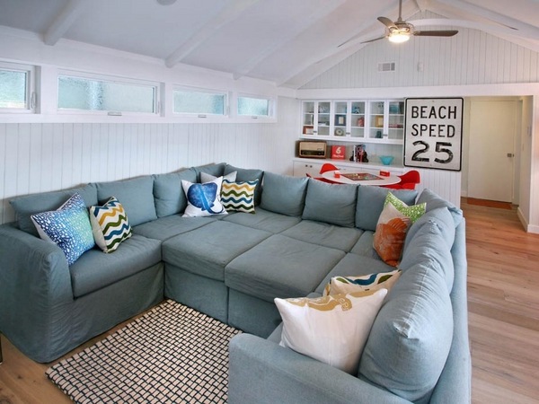 oversized-sofa-living-room-furniture-ideas-blue-sofa-white-walls-wood-floor