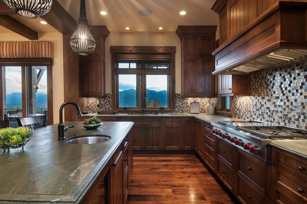 rustic-kitchen design leathered granite countertop wood flooring dark wood cabinets