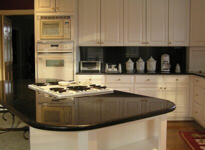 soapstone-vs-granite-review-black-granite-countertops-tile-backsplash