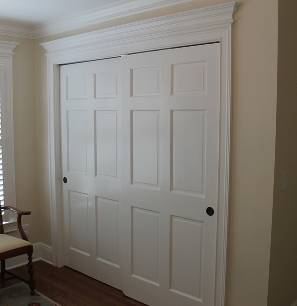 traditional bedroom closet bypass sliding closet doors space saving closet ideas