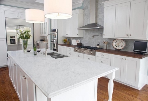 white granite countertops white kitchen cabinets hardwood floor