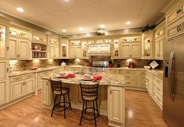 white-kitchen-cabinets-with-antique-glaze-granite-countertops-wood flooring
