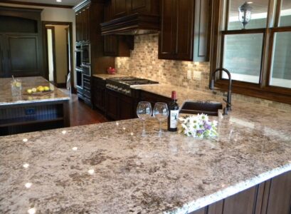bianco-antico-granite-countertops-dark-wood-kitchen-cabinets-luxury-kitchen-countertops