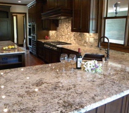 bianco-antico-granite-countertops-dark-wood-kitchen-cabinets-luxury-kitchen-countertops