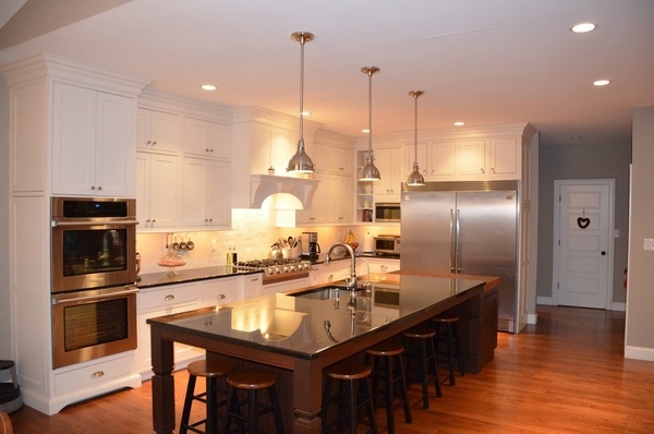 black pearl granite countertop kitchen island with seating pendant lamps white cabinets