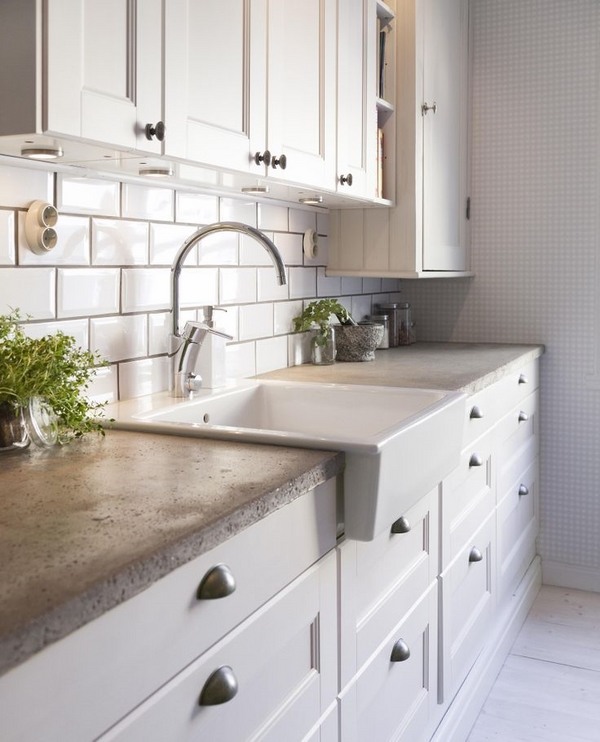 concrete countertop apron sink white cabinets subway tile backsplash