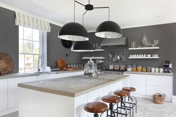 contemporary kitchen white cabinets gray wall color poured concrete countertops modern lighting