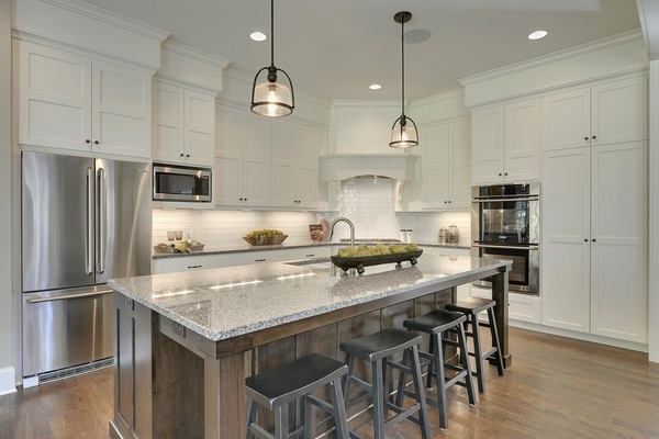 contemporary new caledonia countertops white cabinetry wood flooring