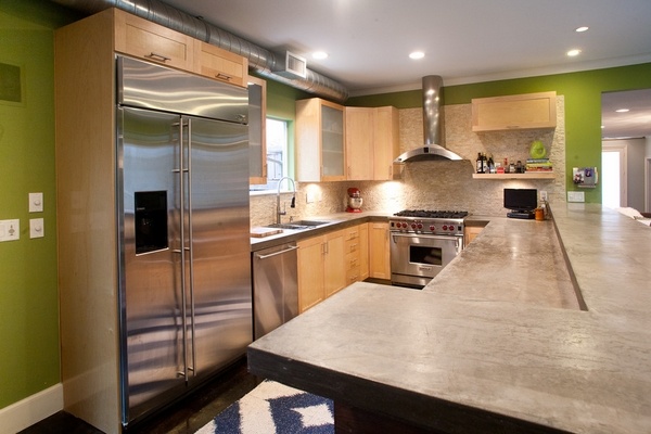 modern kitchen poured concrete countertops wood cabinets green wall color