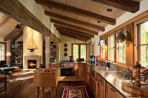rustic kitchen interior ceiling beams wood cabinets stainless steel countertop