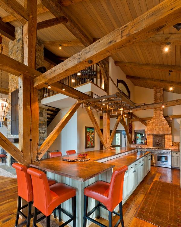 rustic kitchen stained concrete countertop white cabinets wood flooring