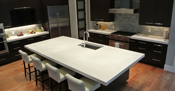 white kitchen island countertop stained concrete countertop dark wood cabinets