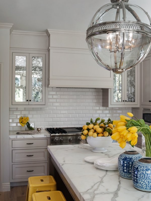 white kitchen white marble countertops subway tile backsplash 