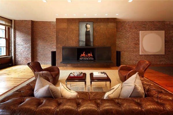 Loft apartment interior hardwood floor brick walls fireplace leather sofa