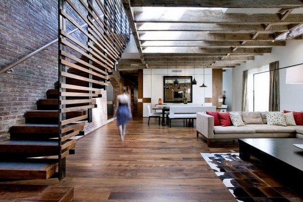Loft style interior design open plan hardwood floor exposed ceiling beams