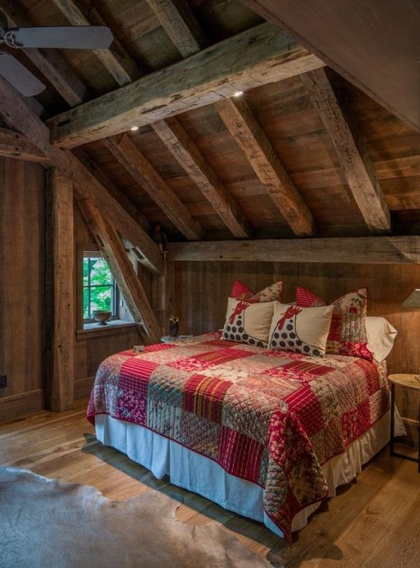 Rustic bedroom interior wooden walls patchwork bedding