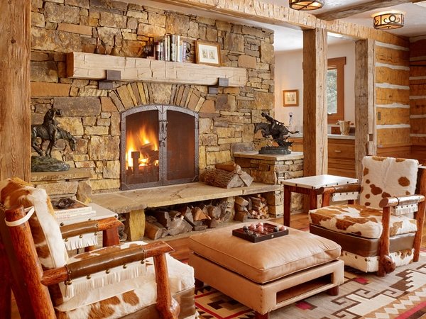 awesome rustic stone fireplace ethnic rug armchairs ottoman