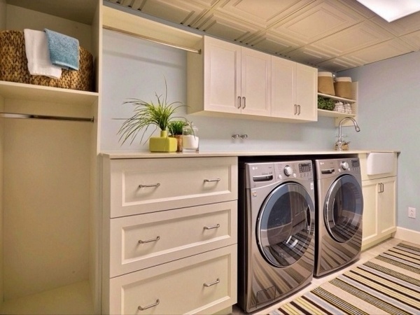 laundry room white blue colors storage drawers cabinets