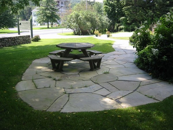 flagstone-patio-ideas-patio-flooring-wooden-outdoor-furniture