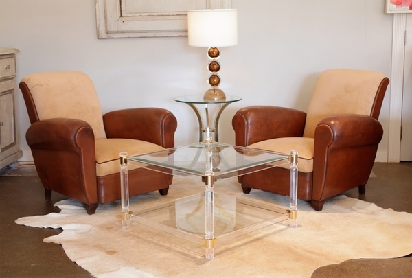 lucite and brass table leather armchairs cowhide rug living room furniture ideas