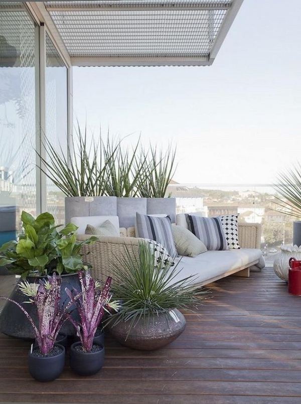 modern balcony decor wood floor sofa green plants