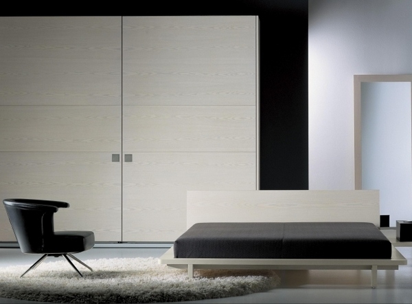 modern bedroom design white bed wardrobe black armchair