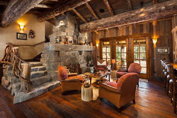 rustic living room interior design hardwood floor stone fireplace stone staircase