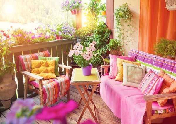 small balcony decoration colorful fabrics wooden furniture