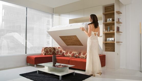 space-saving-furniture-ideas-red-sectional-sofa-murphy-sofa-bed-low-coffee-table