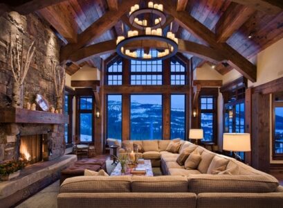 spectacular-rustic-living-room-interior-design-big-sectional-sofa-stone-fireplace-wrought-iron-chandelier