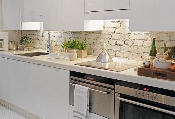 Modern-white-kitchen handleless-cabinets rustic-brick-backsplash-ideas