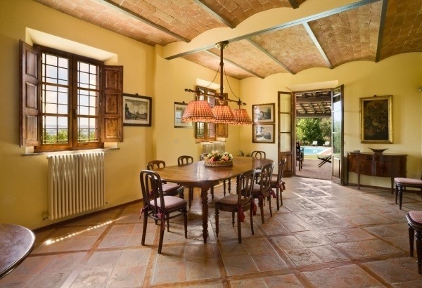 Terracotta tile flooring Mediterranean style Tuscan-decor dining room