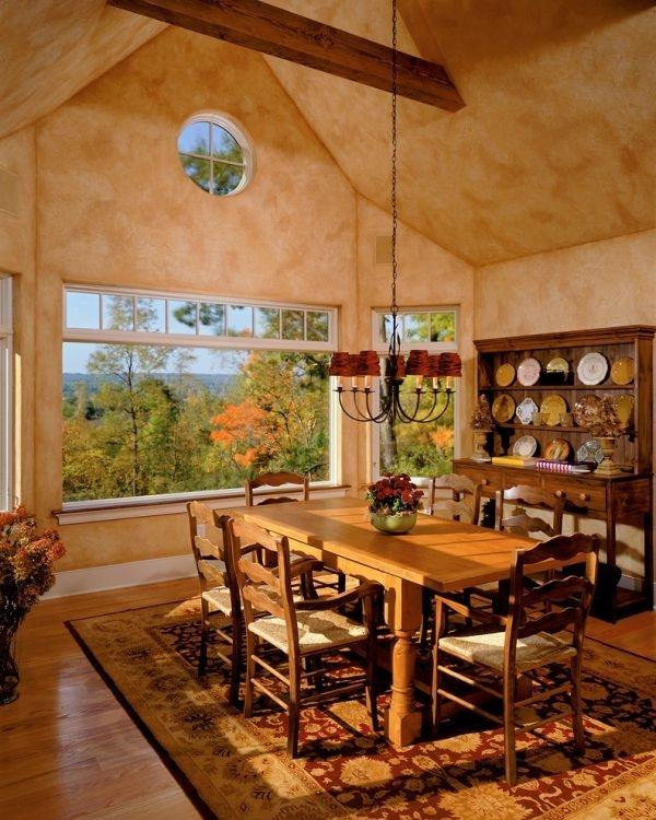 Tuscan decor earthy colors solid wood chairs table rustic carpet plastered wall