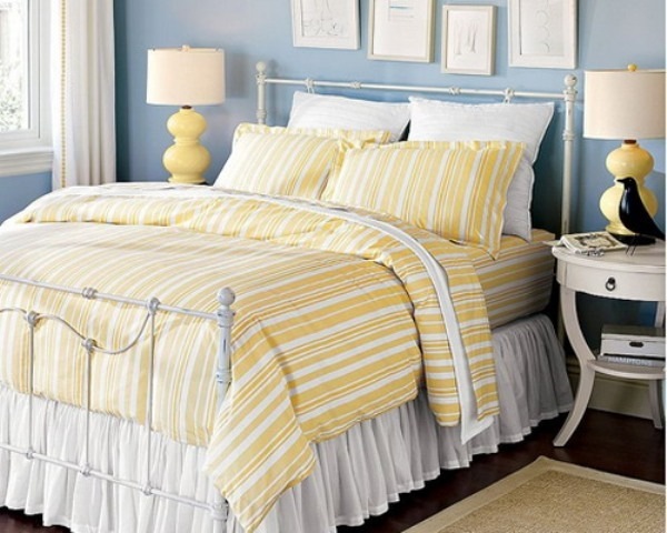 bedroom interior pastels blue wall color yellow bedding set