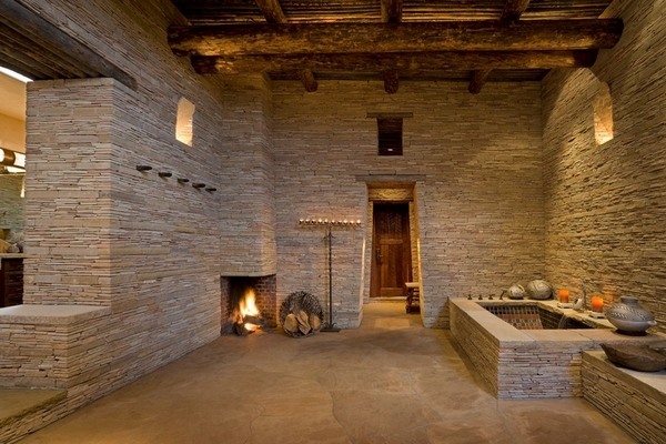 custom bathroom design with tub and fireplace stone walls rustic flair