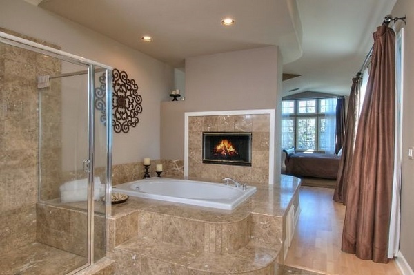 Trendy custom bathrooms with fireplaces for a romantic ...