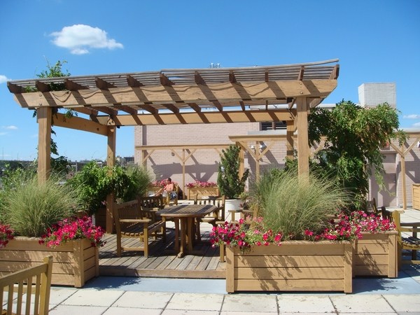 rooftop deck design ideas wooden pergola planter boxes dining furniture