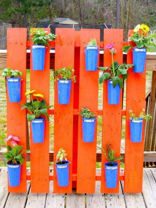 vertical herb garden pallet orange blue flower pots