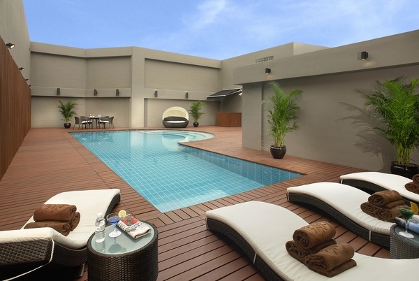 wooden rooftop pool modern sunbeds roof deck design